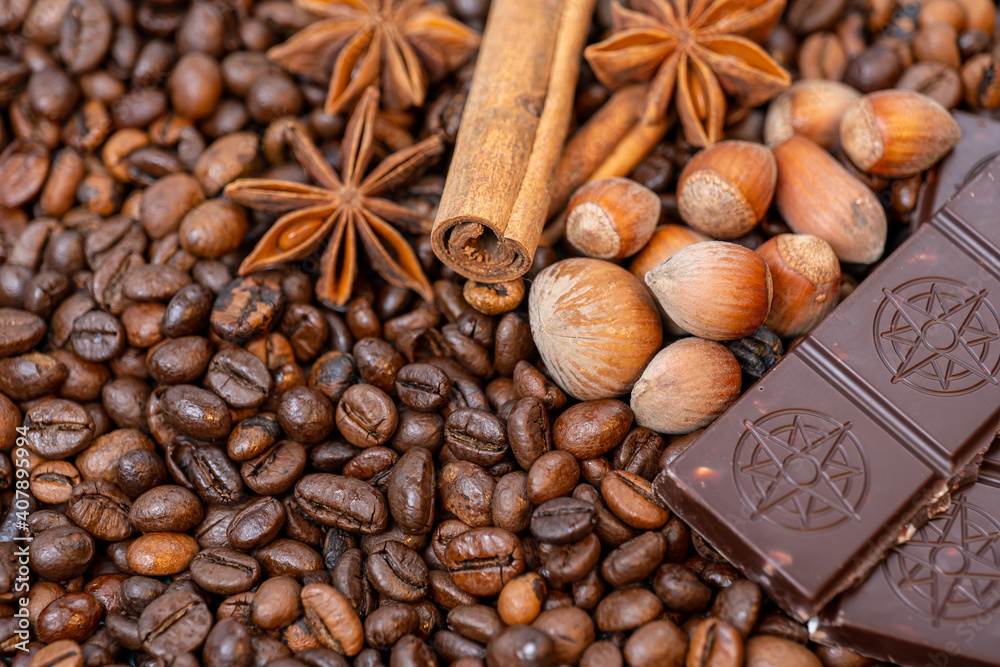 coffee beans close up, top view cinnamon, hazelnuts and chocolate, background image