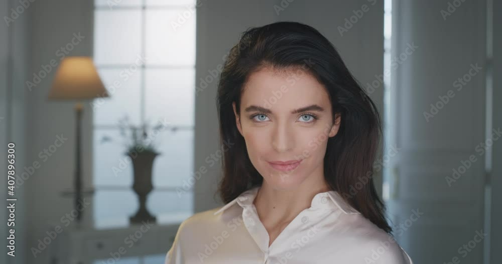Beauty shot of young happy woman with perfect face skin after applying moisturizing cream is making a wink and smiling in camera. Concept of skincare, cosmetics, healthy lifestyle, wellness, wellbeing Beauty shot of young happy woman with perfect face skin after applying moisturizing cream is making a wink and smiling in camera. Concept of skincare, cosmetics, healthy lifestyle, wellness, wellbeing