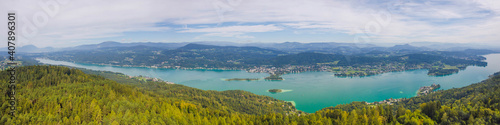 Fototapeta Naklejka Na Ścianę i Meble -  Aerial view of the alpine lake Worthersee, famous tourist attraction for many water activity in Klagenfurt, Carinthia, Austria