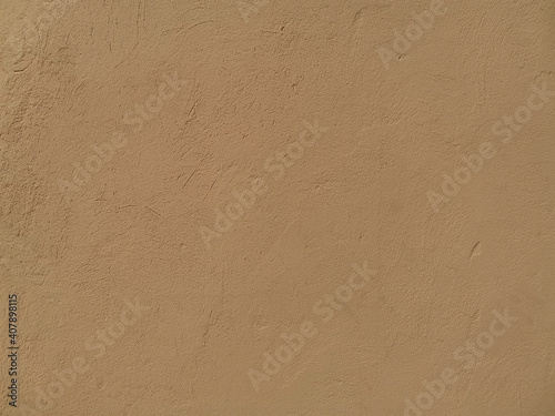 beige plaster wall the facade of the old building. Place for text