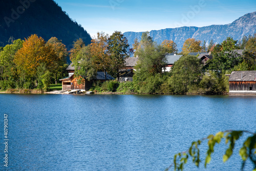 Traditional houses in early autumn on the shoreline of the lake Grundlsee, Styria, Austria.