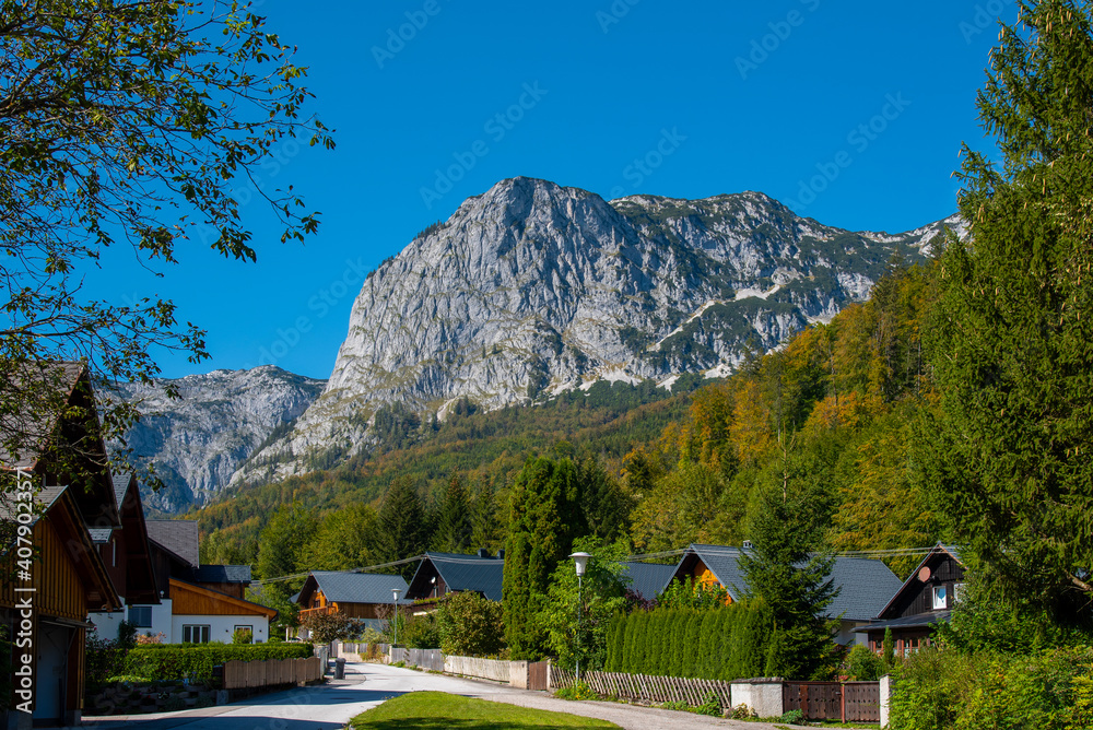 Rural country houses with a mountain in the background, Grundlsee, Styria, Austria.