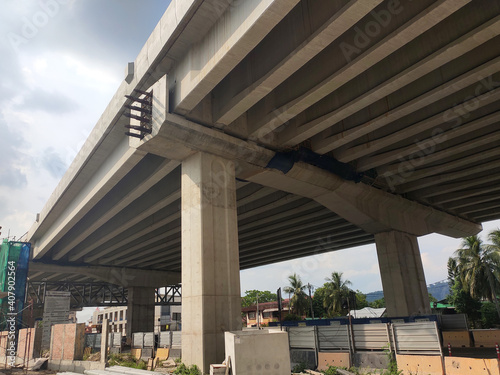 PENANG, MALAYSIA - MARCH 21, 2020: Overhead road under construction. The massive concrete column used to support the concrete road deck. Construction work is in full swing. photo