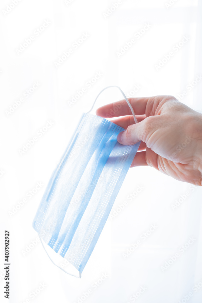hand holds a medical face mask against viruses and bacteria on a white background. Pandemic Covid-19. medicine and quarantine concept
hand holds a medical face mask against viruses and bacteria on a white background. Pandemic Covid-19. medicine and quarantine concept