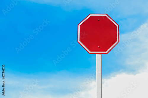 Isolated blank red traffic sign on pole with clipping paths.