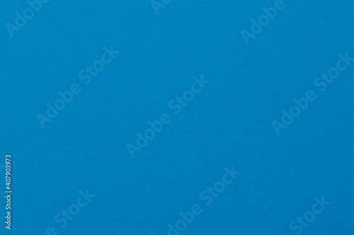 Detail of blue colour paper sheet (school poster board) texture. Plain background