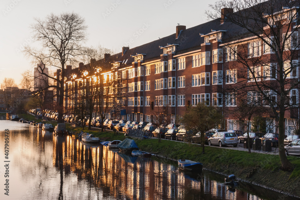 The Dutch capital Amsterdam is in the early morning. The sun rises. Netherlands