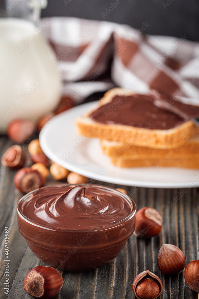 toasts with chocolate butter on a dark wooden rustic background