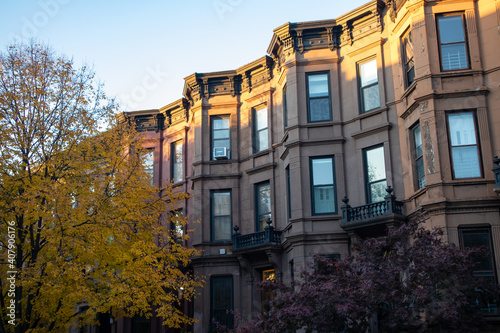 Row of Similar Old Brownstone Homes in Park Slope Brooklyn New York with Trees during Autumn © James