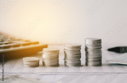 Stack of money coin on accounting sheet with selective focus, Business and financial concept.  photo