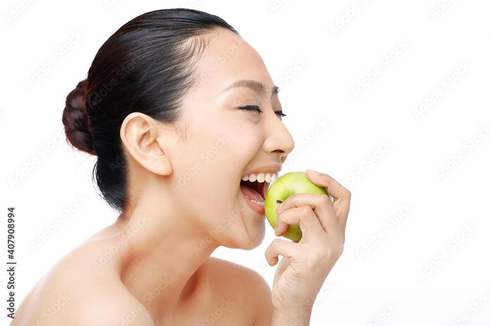 Beautiful woman biting apple Beautiful woman biting apple