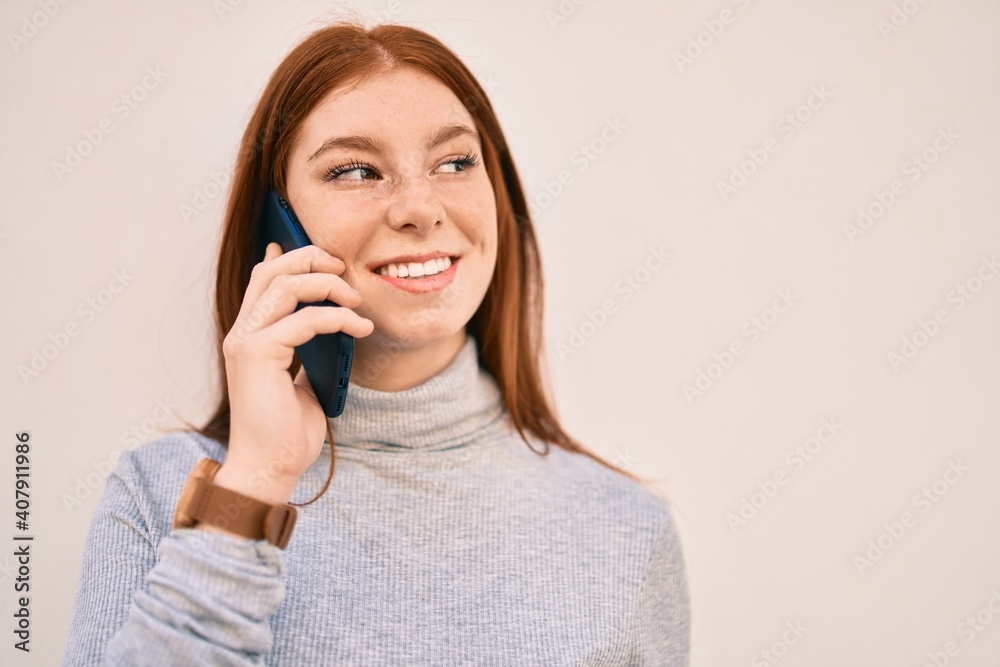 Young irish teenager girl smiling happy talking on the smartphone at the city. Young irish teenager girl smiling happy talking on the smartphone at the city.