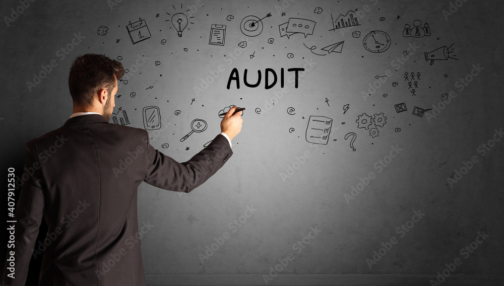 businessman drawing a creative idea sketch with AUDIT inscription, business strategy concept businessman drawing a creative idea sketch with AUDIT inscription, business strategy concept