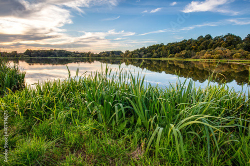 Lake at sunset. Countryside rural scenery in Poland