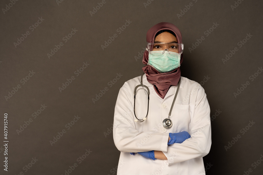 Researcher wearing protection with grey background. Researcher wearing protection with grey background.