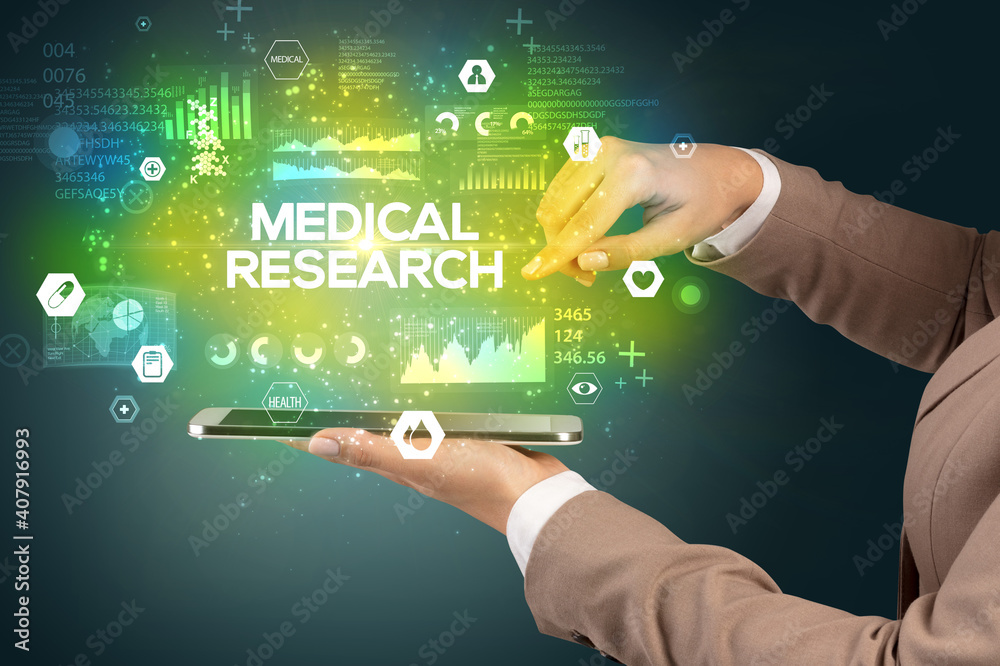 Close-up of a touchscreen with MEDICAL RESEARCH inscription, medical concept Close-up of a touchscreen with MEDICAL RESEARCH inscription, medical concept
