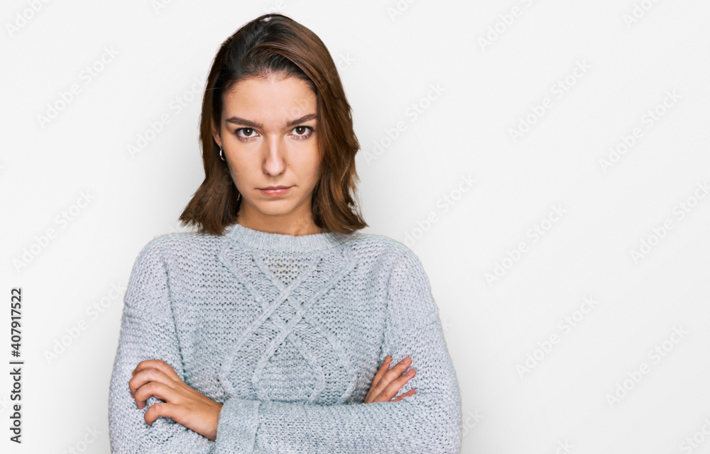 Young caucasian girl wearing casual clothes skeptic and nervous, disapproving expression on face with crossed arms. negative person. Young caucasian girl wearing casual clothes skeptic and nervous, disapproving expression on face with crossed arms. negative person.