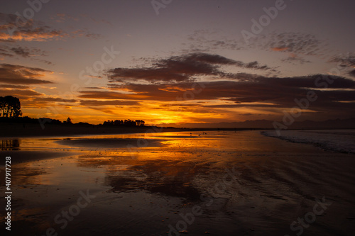 beach in nelson during a breathtaking sunset on Tahunanui Beach at Nelson  New Zealand