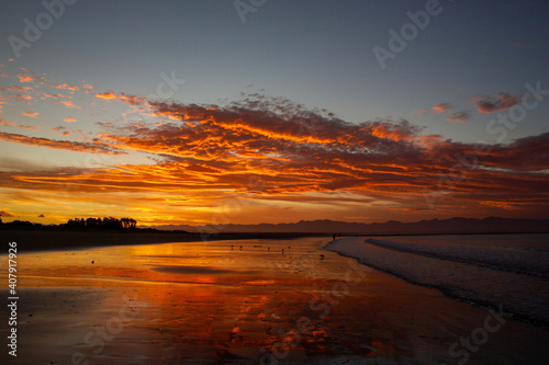 beach in nelson during a breathtaking sunset on Tahunanui Beach at Nelson  New Zealand