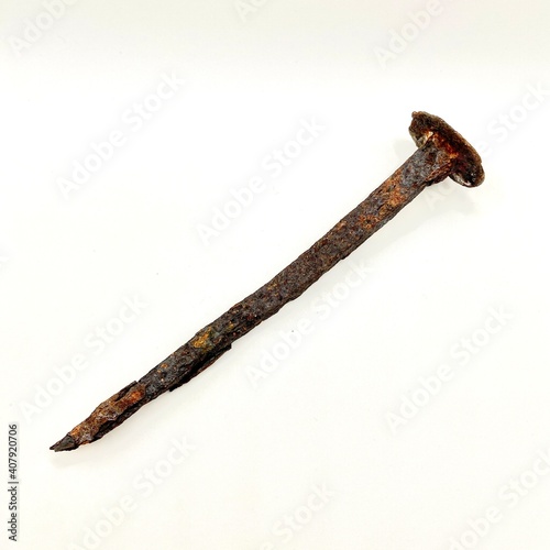 a rusty metal nail - very old