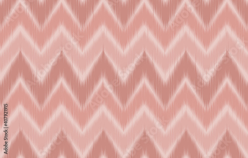 Pink pastel color tone control of zigzag chevron ikat fabric texture while is a vertical and horizontal seamless pattern.