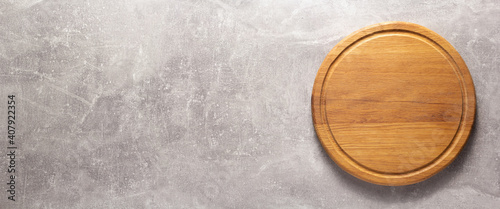 Panel kuchenny z motywem Pizza or bread cutting board for homemade baking on table. Food recipe concept at stone background texture