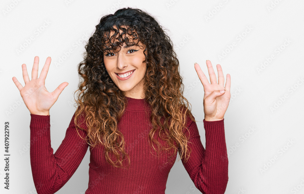 Young hispanic girl wearing casual clothes showing and pointing up with fingers number nine while smiling confident and happy. Young hispanic girl wearing casual clothes showing and pointing up with fingers number nine while smiling confident and happy.