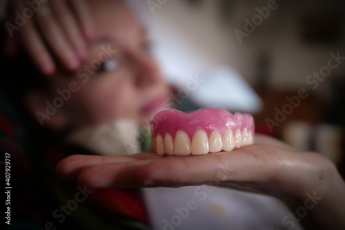 
client satisfied with her dental prosthesis