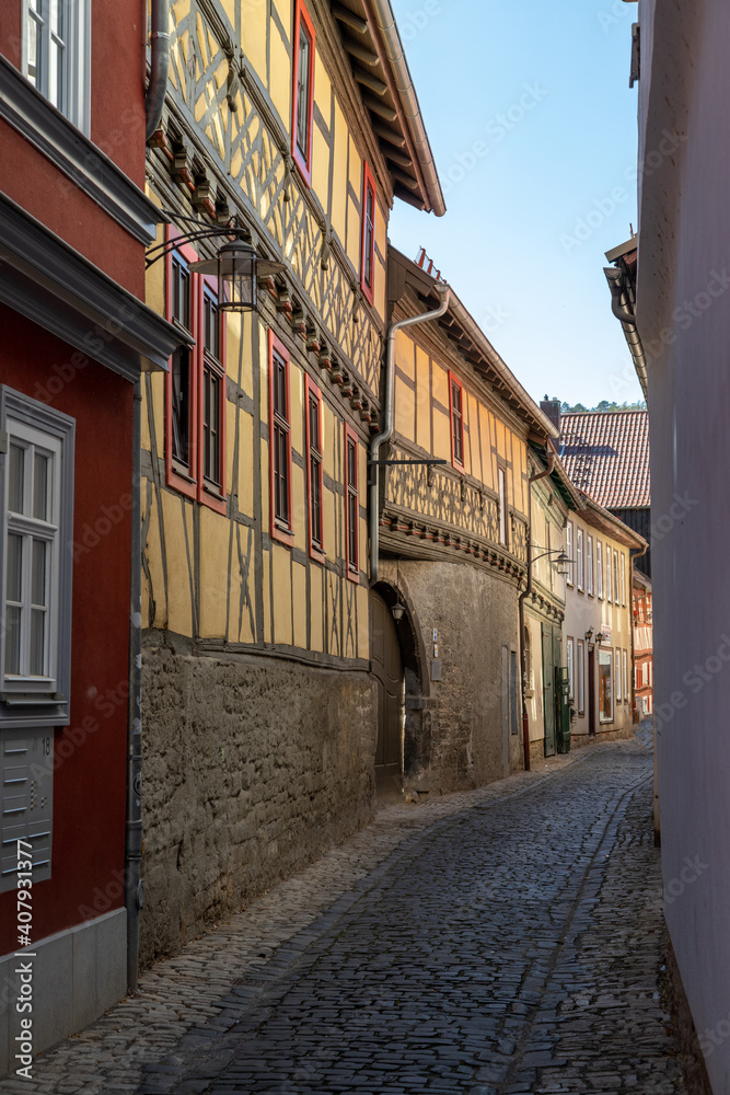 Narrow cobbled alley with facades of half-timbered houses in Meiningen