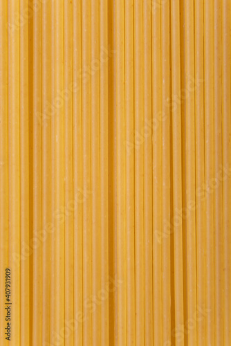 long pasta spaghetti background yellow