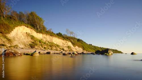 Coastal beach during sunset photo