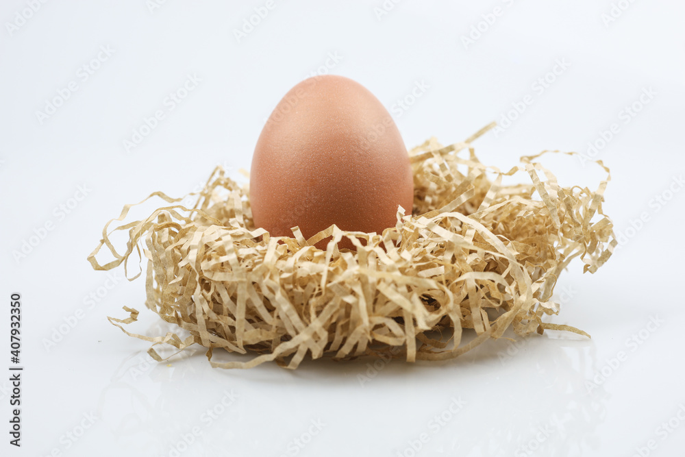 Chicken eggs in nest of straw. Isolated on white background. Chicken eggs in nest of straw. Isolated on white background.