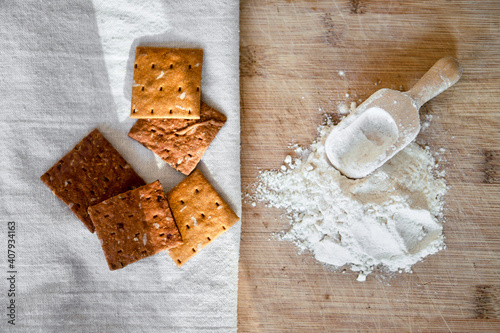 Cricket insect crackers snack and cricket flour for eating as food items made of cooked insects as a good source of protein. Entomophagy concept. The concept of protein food sources from insects.