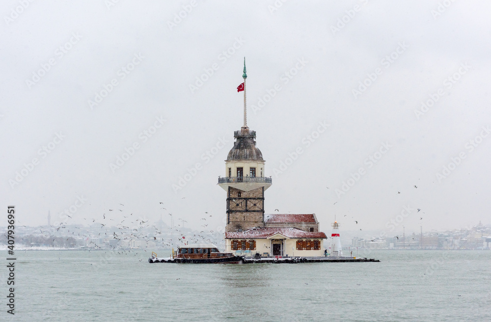 Snowy day in Uskudar with Maiden's Tower. Istanbul, Turkey.