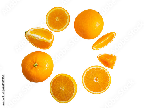 Orange fruit slices circle frame made of orange pieces, isolated on white background