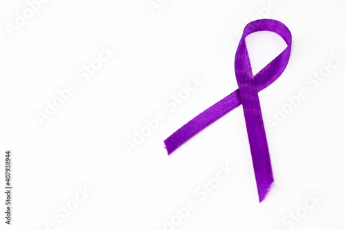 Purple awareness ribbon on white background