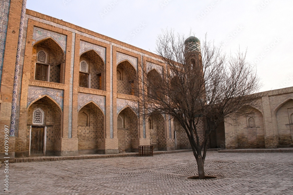 Khiva, Uzbekistan - December 02 2019: Historic architecture of Itchan Kala, walled inner town. UNESCO World Heritage Site.