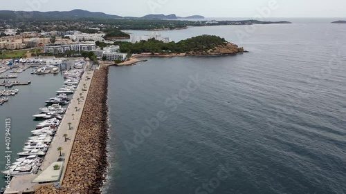 Wallpaper Mural Aerial drone footage of the beautiful island of Ibiza, Spain in the Balearic islands showing the beach and harbour area by the mediterranean sea in Santa Eularia des Riu on a bright sunny summers day Torontodigital.ca