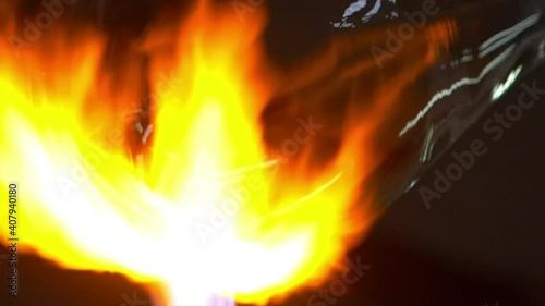Glass handmade production, golden ball of hot glass.