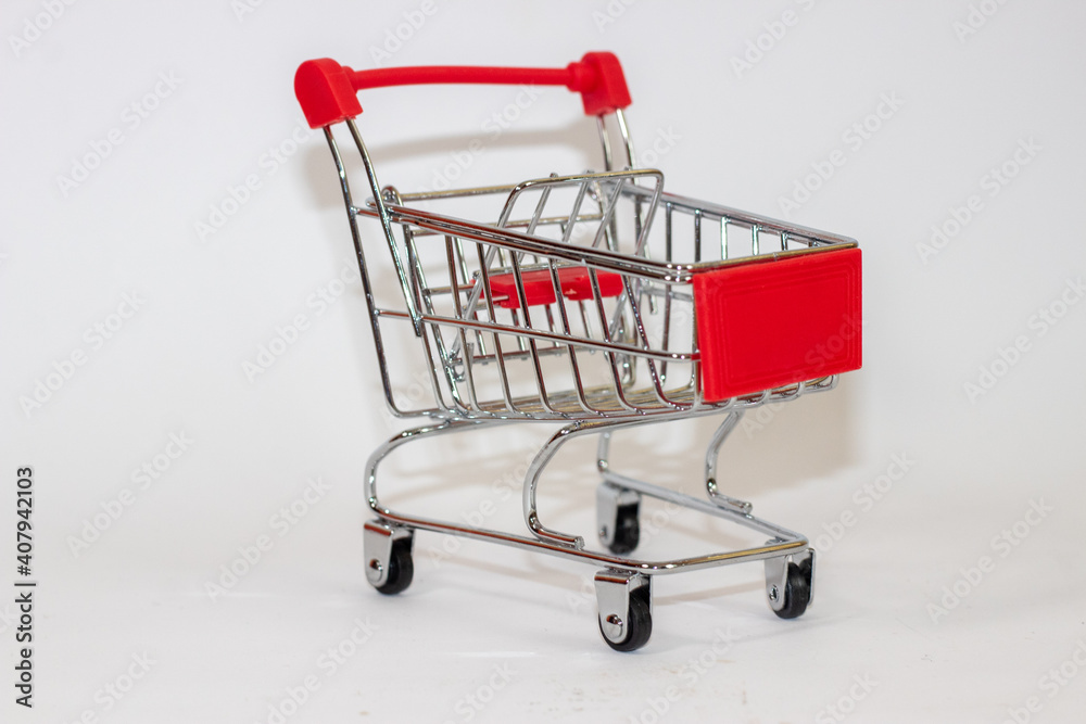 Red toy cart on white isolated background