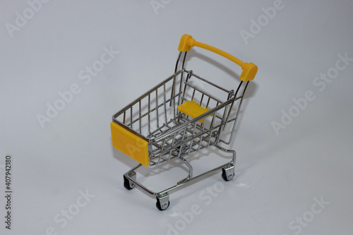 Yellow toy cart on white isolated background