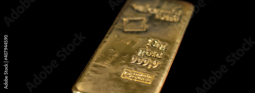 Valcambi Suisse gold bullion bar on black background. Large cast investment gold ingot. Swiss gold. Business and finance.