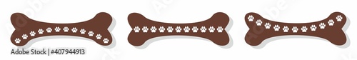 Imprints of dog paws on the bone. A row of white dog tracks on a brown cookie. Vector drawing of a logo for a dog shelter. Symbol of love for dogs
