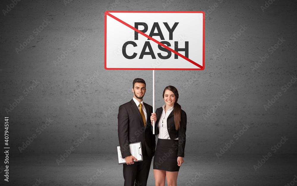 business person holding a traffic sign with PAY CASH inscription, new idea concept business person holding a traffic sign with PAY CASH inscription, new idea concept