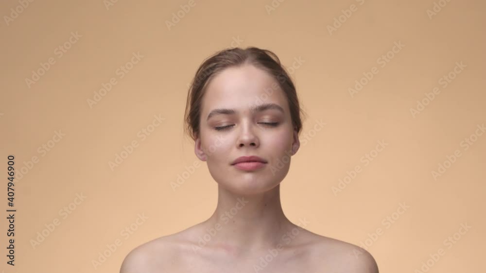 Natural beauty concept. Head shot of young girl with healthy skin posing after cosmetic rejuvenation procedure