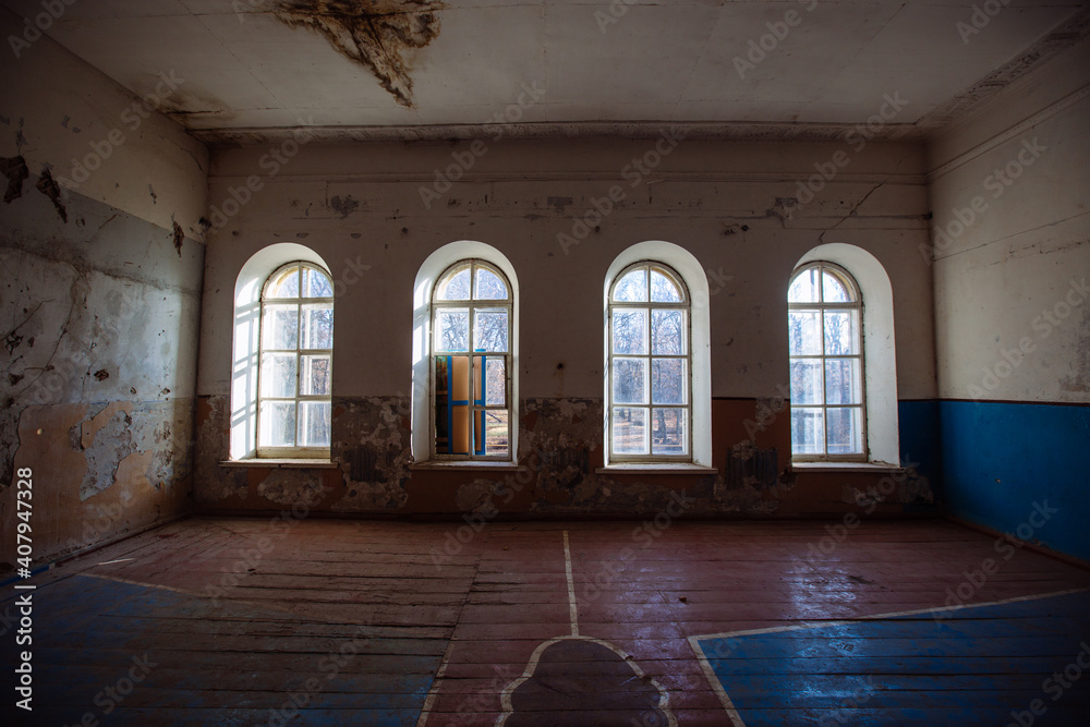 Large empty hall inside old abandoned building