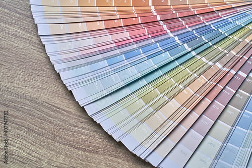 Obraz na płótnie Color wheel palette for choosing paint tone. Various colors on wooden table background with copy space. Interior designer tool. w salonie