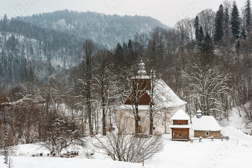 Fototapeta Naklejka Na Ścianę i Meble -  Lopienka Wooden Orthodox Church in Bieszczady Mountains Park at Winter Snowy Season in Poland