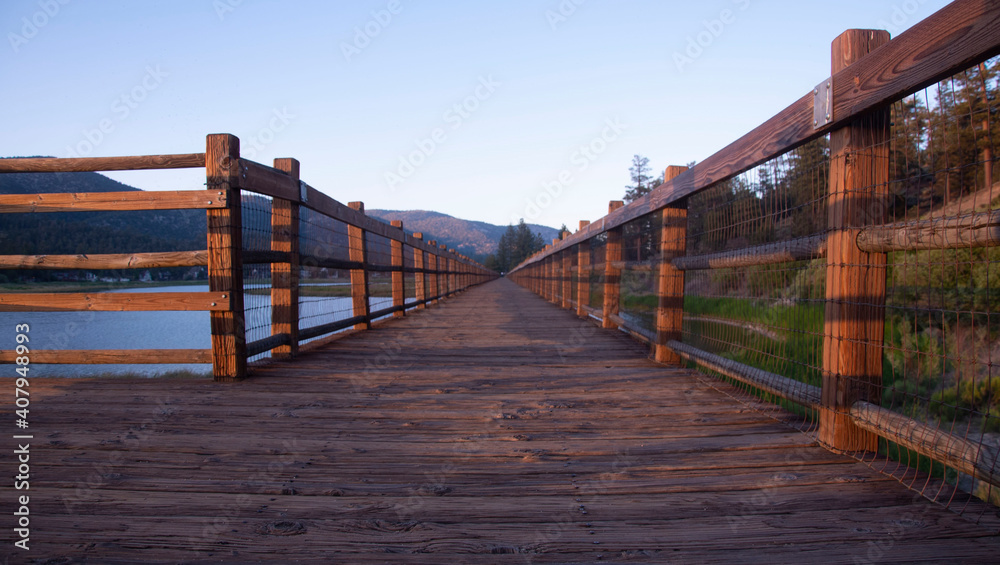 Wooden footpath next to a lake