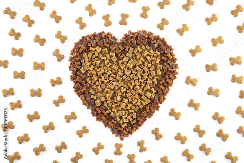 Dried animal pet dog food in heart form isolated on white background . Dog love dry food Biscuits